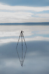 The salt lake in Ankara, Turkey fascinates visitors with its white salt cover. The photo shows many visitors walking on the salt lake.
