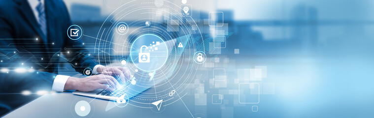 IT professional analyzing information security dashboard on laptop, data protection, threat detection, and system monitoring.