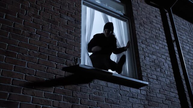 silhouette on windowsill at night brick apartment ledge, crouching intruder pauses before entry, moonlight backlighting figure, curtain fluttering, urban quiet and suspenseful tension