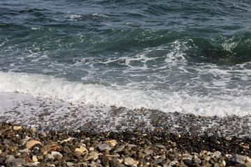 Rock textures and waves on the shore in Almeria, Spain