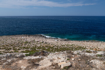 Limestone coastal landscape under clear sky in Malta. Perfect for travel magazines, tourism materials, or Mediterranean guides.
