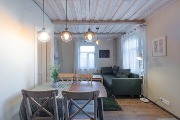 Modern Home Stylish Living Room and Dining Area with Wooden Table and Cozy Sofa