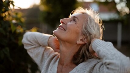 Elderly Caucasian woman enjoying sunset, peaceful ambiance in garden setting, autumn reflection and mindfulness moment