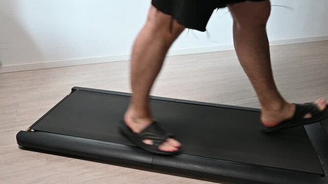 a man's legs walking on a treadmill