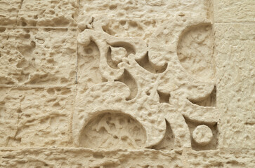 Baroque Weathered Stone carved ornament on facade of building in Lecce, Italy