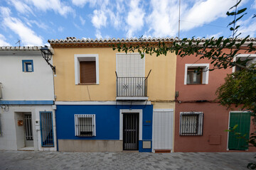 Colourful traditional houses lining a street in denia, spain