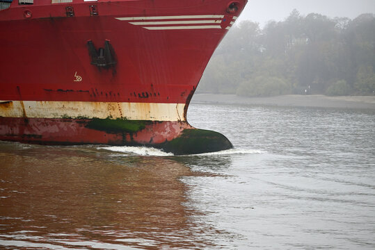 Vessels arrive at Hamburg Harbor on a foggy day. Crane, Vessel, River, Water. Hamburg Harbor, Hamburg, Germany