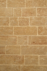Fototapeta premium New yellow stone wall closeup in Lecce, Italy