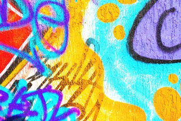 Obraz premium Vibrant graffiti abstract in neon orange, blue, purple. 90s urban style, fluorescent clash, textured paint. Street art, murals, urban visuals, creative banner.