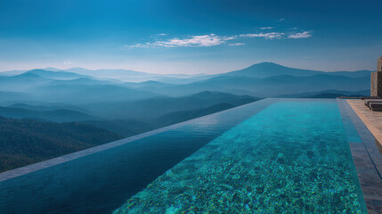 Stunning infinity pool overlooking misty mountain range in serene landscape at dawn