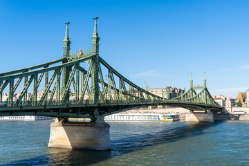 The green colored Liberty Bridge or Freedom Bridge on the Danube. Budapest, Hungary