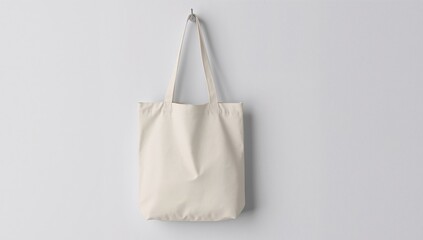 Simple Fabric Bag Against a Clean Wall, Suspended by Hook, Illuminated by Soft Light.