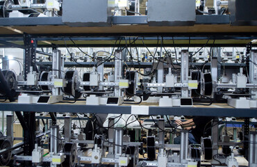 Many 3D printers printing an object. 3D printers simultaneously printing model from molten plastic....