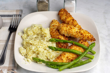 chicken tenders with asparagus and mashed  potatoes