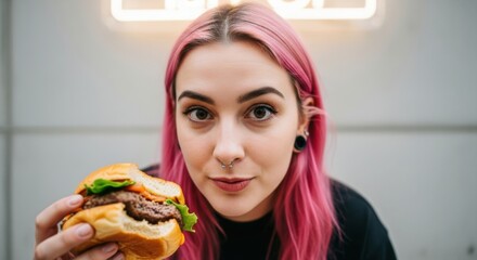 Young woman smiling while eating a healthy sandwich meal for lunch