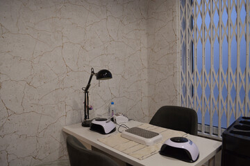 Room for manicure with two working places in the beauty salon. nail salon room. The concept of nail aesthetics and self-care
