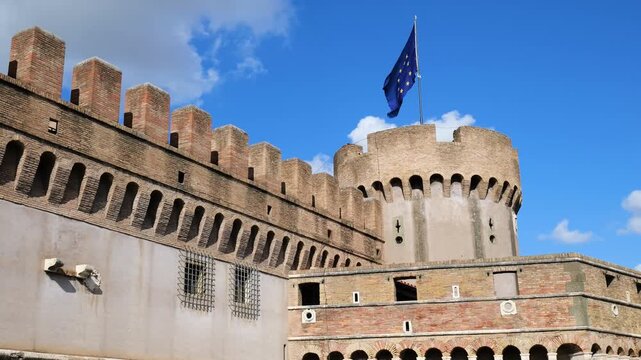 blue flag flies atop one dome upper castel sant'angelo also known mausoleum hadrian rome front of historic landmark italy roman empire emperor 