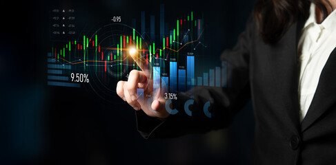 Professional interacts with a digital financial display, showcasing market trends and analytics,...