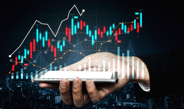 A hand holds a smartphone displaying vibrant stock market graphs and data, symbolizing financial growth and investment trends against an urban backdrop. Scalp