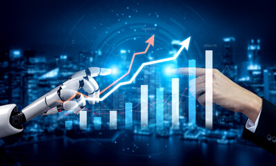 A striking image showing a human hand reaching towards a robotic arm, both analyzing digital graphs...