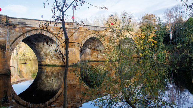 The bridge over the River Tees at Yarm in the autumn showing the autumn colours. 