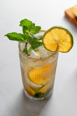 Backlit Close-up of Mandarin Lime Mojito with Brown Sugar Rim