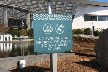 Warning Sign by the Lake “No Swimming or Drinking of Water (Not Potable)