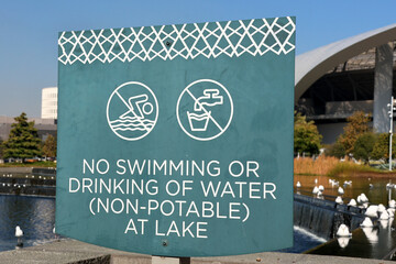 Warning Sign by the Lake “No Swimming or Drinking of Water (Not Potable)