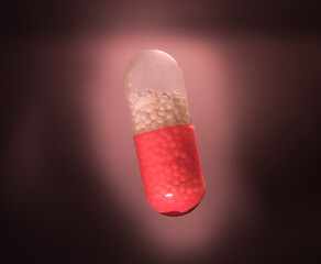 Red and White Medical Capsule with Granules Inside