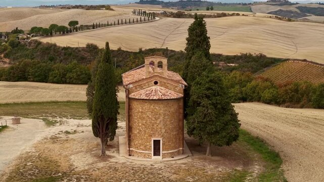 Idyllic Tuscany scenic landscape. Most picturescque place of Valle d'Orcia with little chapel. Italy tourism, tuscan scenery. Orcia valley ,aerial drone 4k hd footage