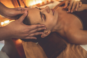 Closeup caucasian woman enjoying relaxing anti-stress head massage and pampering facial beauty skin...