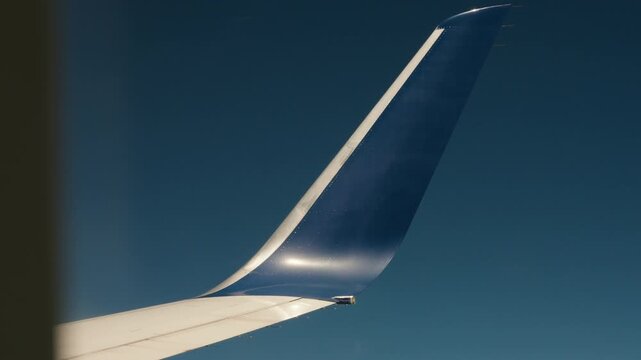 Airplane winglets view from window seat with the sky in the background