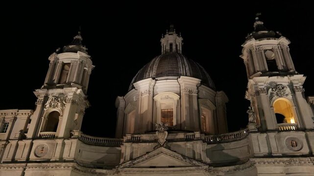 night lights illuminate sant'agnese agone three domes panoramic scene front in rome landmark architecture historic cathedral nighttime lighting urban scenic 