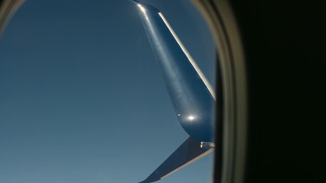 Airplane winglets view from window seat with the sky in the background