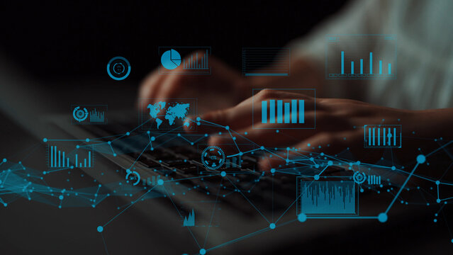 A close-up view of hands typing on a laptop, with digital graphs and charts layered above, representing the intersection of technology, analysis, and data-driven decision-making. Xenic
