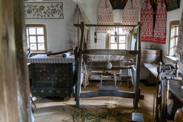 Traditional weaving loom in rustic folk house interior