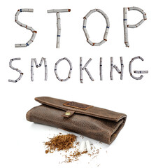 Text stop smoking made from broken cigarettes with faces painted on white background