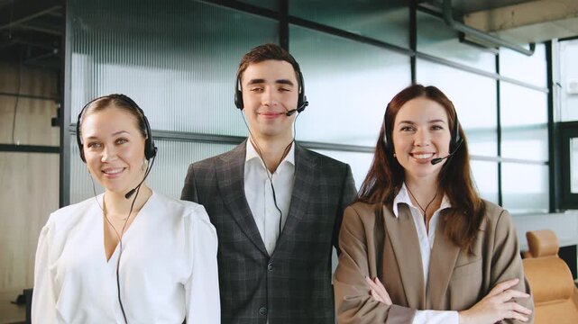 Professionals of call center in a modern office space while providing client support through their headsets, showcasing teamwork and dedication - Powered by Adobe