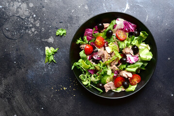 Tuna salad with fresh vegetables. Top view with copy space.