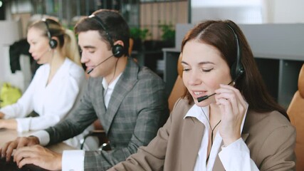 Consultants assisting clients in a busy call center, providing technical support and customer service - Powered by Adobe