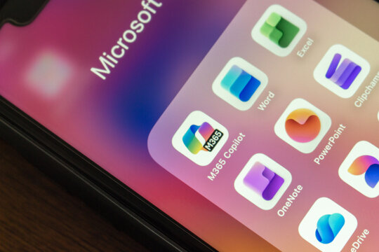 Quito, ECUADOR - Oct 13 2025 : Smartphone screen displaying Microsoft 365 app icons including Copilot, Word, Excel, PowerPoint, OneNote, and others in a folder.
