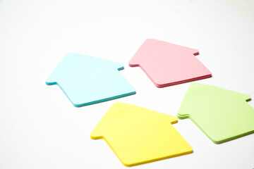 Pastel Colorful sticky Notes on white background , house shape paper icon