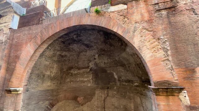 reserved space suggests place for statue pedastle classical architecture upper or pantheon rome appears above arches cornices careful stonework near side pedestal niche temple heritage 