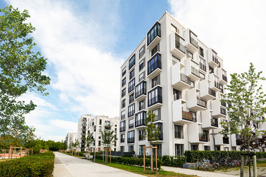 Residential area with ecological and sustainable green residential buildings, low-energy houses with apartments and green courtyard