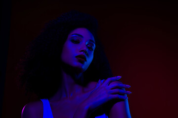 Portrait of a Young Woman in Neon Lighting Highlighting Glamour and Modern Fashion Style