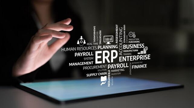 Dynamic image showing a hand reaching for a digital screen displaying a word cloud representing ERP solutions, emphasizing business management concepts in various industries. Tessel