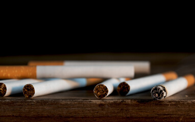 Close-Up of Cigarettes on Wooden Table &ndash; Tobacco Addiction, Smoking Habit, and Health Risk Concept