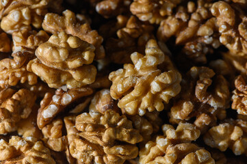 Walnut Kernels as Background Golden Halves and Whole in Warm Tones