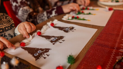 Christmas crafts: festive artwork of trees and reindeer made by children