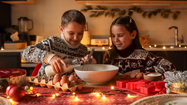 Children baking together in a cozy kitchen during the holiday season